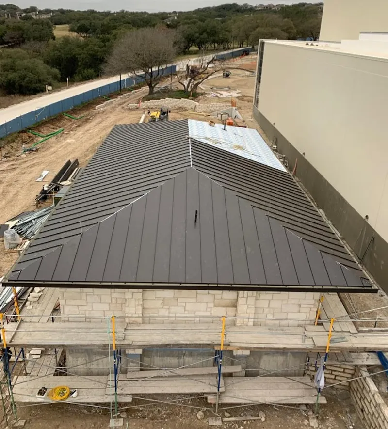Metal roof new construction with scaffolding in Belton